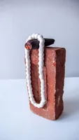 Cigar, Pearls, and Brick 1